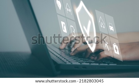 Insurance online digital technology concept. Hand using labtop buy family, car, health and travel Insurance Policy Protection icon on virtual screen , Accident Claim Risk Defense.