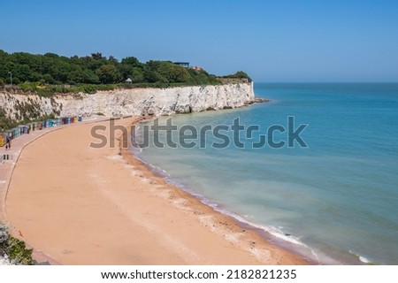 Stone Bay featuring sandy beach and chalk cliff in the seaside town of Broadstairs, east Kent, England Royalty-Free Stock Photo #2182821235