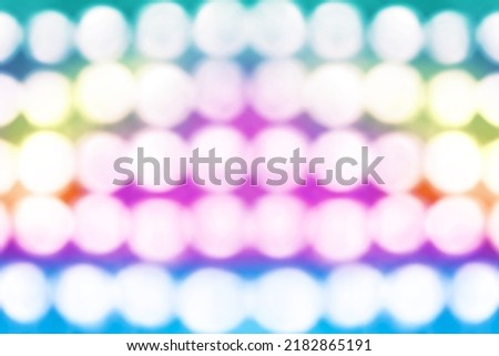 Abstract retro rainbow pink blue green yellow color bokeh lights happy birthday party background invite, 80s disco club concert 1980s night karaoke show, girl dance music or girly unicorn pony texture Royalty-Free Stock Photo #2182865191