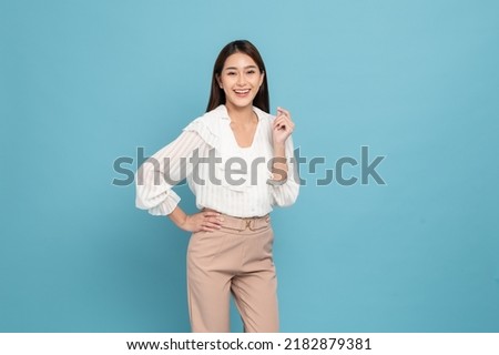 Young beautiful asian woman with smart casual cloth smiling isolated on blue background