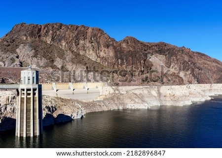 View of record low water level of Lake Mead, key reservoir along Colorado River, during severe drought in the American West from Hoover Dam. Royalty-Free Stock Photo #2182896847