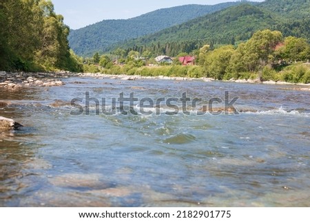 Mountain river, clear azure water against the backdrop of mountains