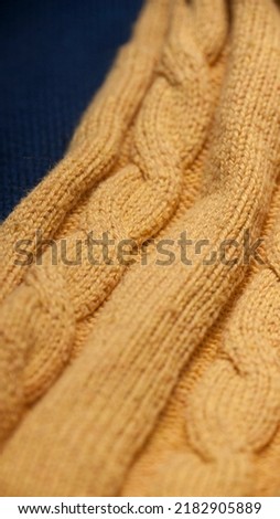 Yellow cable knit jumper detail