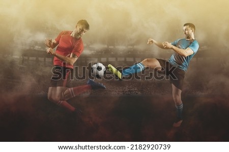 Two soccer player in action on smoke background