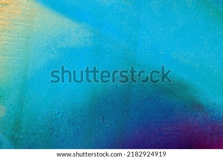 Art under ground. Beautiful street art graffiti background. The wall is decorated with abstract drawings house paint. Modern style urban culture of street youth. Abstract picture on wall Royalty-Free Stock Photo #2182924919