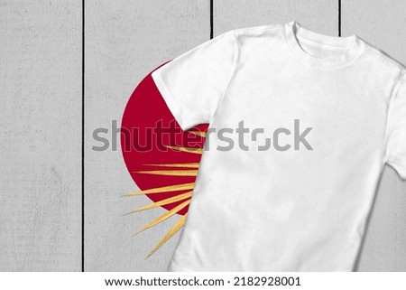 Patriotic t-shirt mock up on background in colors of national flag. Japan