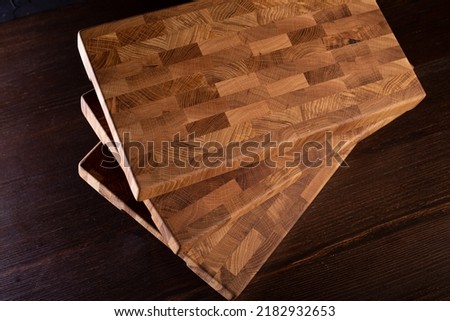 End cutting board on dark background Royalty-Free Stock Photo #2182932653