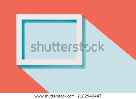 White rectangle frame on a two tone pastel background. Geometric minimal copy space.