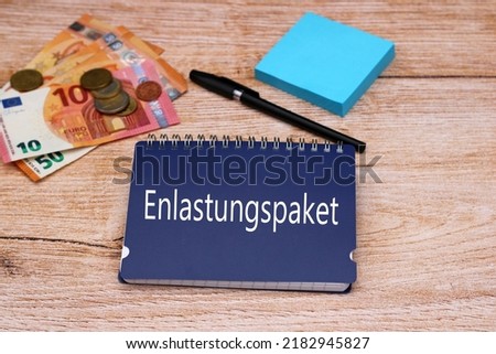 The German word Entlastungspaket with euro banknotes. Entlastungspaket means translated relief package. Royalty-Free Stock Photo #2182945827