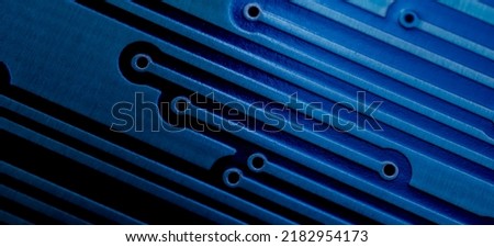 a printed circuit board in blue Royalty-Free Stock Photo #2182954173