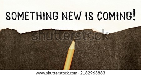 Handwriting text Coming Soon. Concept meaning something is going to happen in really short time of period Colored clipboard blank paper sheet marker old wooden vintage background.