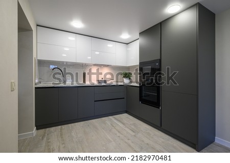 Modern simple trendy dark grey and white kitchen Royalty-Free Stock Photo #2182970481