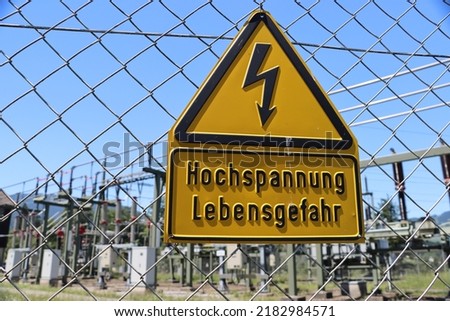 Attention: high holtage, danger for life is tranlation for german "Hochspannung Lebensgefahr"