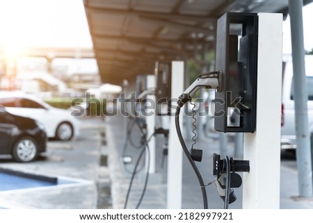 Electric car on electric car charging station. Power supply for electric car charging. Clean energy concept Royalty-Free Stock Photo #2182997921