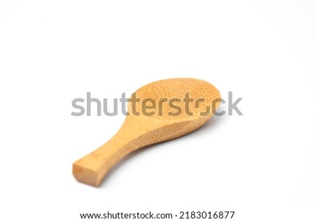 The Small Wooden Decorative Spoon Isolated on White Background