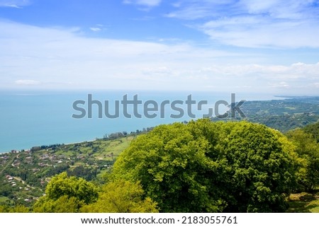 Amazing epic shot of sea coast from top of mountain. Incredible summer views of travel lifestyle. Top of a scenic view of the mountains, town, and sea in a popular tourist destination for vacation