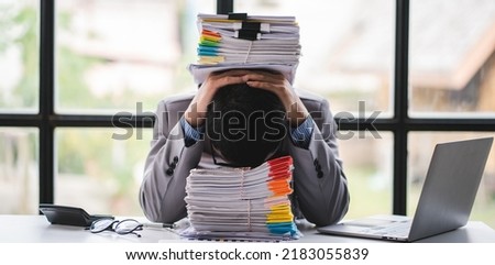 business documents businessman check legal document review Prepare documents or analysis reports, tax items, accounting documents, data contracts, office partner agreements. Royalty-Free Stock Photo #2183055839