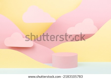 Circle pink podium mockup with abstract mountain landscape -  pastel pink, yellow, mint color slopes, clouds in baby cartoon naive style. Template for presentation of cosmetic, advertising, showing. 