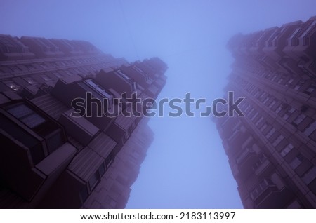 Two tall residential buildings in the form of a tower, immersed in a misty violet sky. Cyberpunk stylistics. Dramatic, depressing mood.
