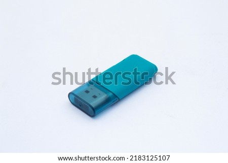 USB flash drive stick isolated on white background. For concepts of digital technology, computing, work and school life. Selective focus, closeup