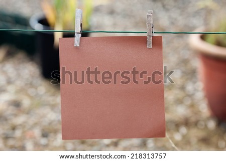 paper card hanging on string