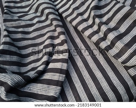Abstract black and white striped fabric textured background