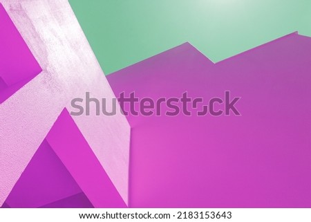 set of walls with geometric shapes of intense colors, purple or pink with green sky. concept unreal, futuristic, modern, contemporary. good for background and presentations. free space. magenta cyan