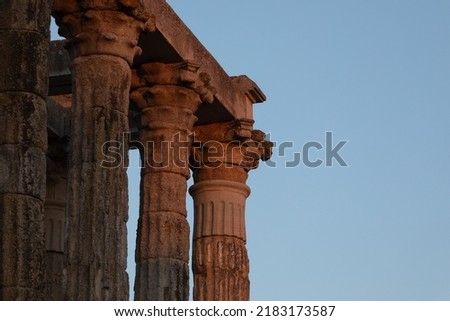 Detail of the capitals and columns of the Temple of Diana at sunset, a Roman temple built in the 1st century AD in the city of Augusta Emerita, capital of the Roman province of Lusitania, now Merida Royalty-Free Stock Photo #2183173587