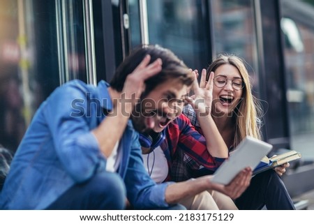 Group of friends taking selfie with tablet pc