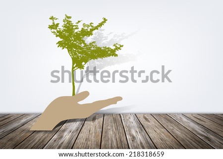 Paper cut of eco on wooden floor