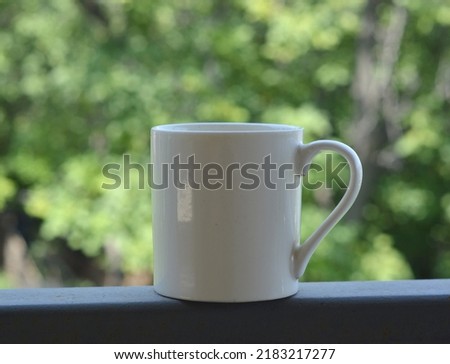 White mug mock-up background. Blank black handle mug mockup photo for your design. 