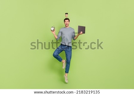 Full body image photo of workaholic early morning businessman doing multitasks during work hours isolated on green color background