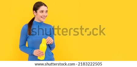 Woman isolated face portrait, banner with copy space. happy woman hold mineral water. feel thirsty. young girl with sport plastic bottle. Royalty-Free Stock Photo #2183222505