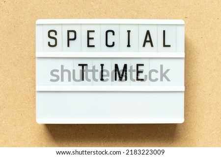 Lightbox with word special time on wood background