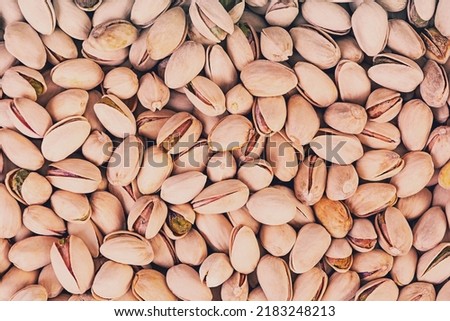 Background of pistachio nuts. Roasted salted pistachios.
