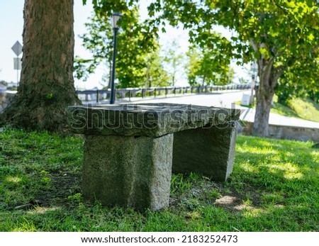 Old stone bench in a New England cemetery Royalty-Free Stock Photo #2183252473