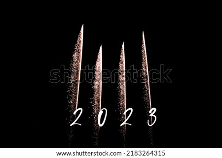 Happy new year 2023 orange fireworks rockets new years eve. Luxury firework event sky show turn of the year celebration. Holidays season party time. Premium entertainment nightlife background