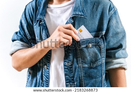 Person using credit card pay in pocket. cool man hand put card in pocket. customer using credit card from pocket. man holding card showing business credit service from pocket. Credit cash deal concept