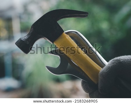 Handyman hold the tools for his working. Labor day concept.