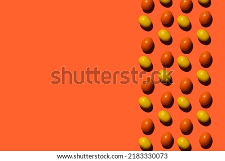 colorful candies on orange background. High quality photo
