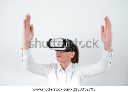 Woman Wearing Vr Glasses And Presenting Important Messages Between Hands. Businesswoman Having Virtual Reality Eyeglasses And Showing Crutial Informations.