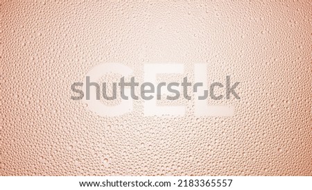 Writing gel printed on the wet glass on beige background | skin moisturizing gel commercial