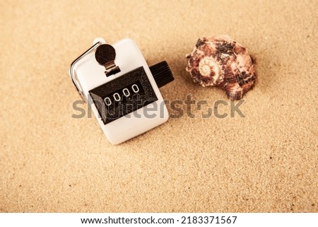 image of clicker seashell sand background 