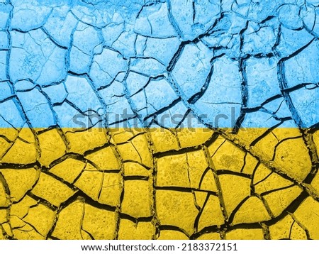 Cracks on the ground on a blue-yellow background.