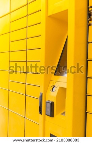 Modern yellow shopping locker. Bar code reader for Skans QR Code on Mobile phone Self-service Locker Cell Modern Shipping and Delivery Concept with Contactless Automated Postal Box. Parcel Locker