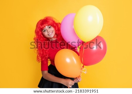 glad kid with party balloon on yellow background