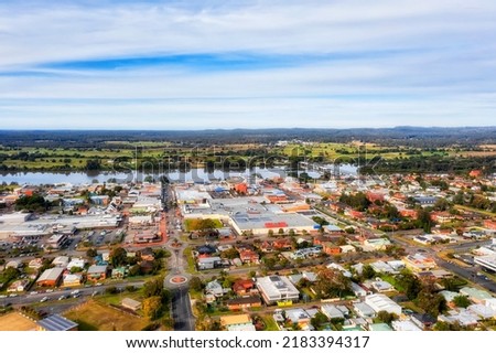 Taree local rural town on Manning river in Australian NSW - aerial view towards Martin bridge over downtown streets. Royalty-Free Stock Photo #2183394317