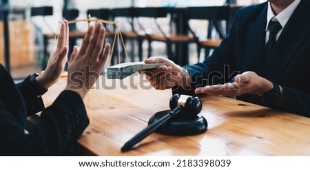 Side view of judge showing stop gesture near client with dollars, anti-corruption concept Royalty-Free Stock Photo #2183398039