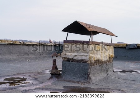Ventilation hood on the roof of an apartment building. Background with copy space for text