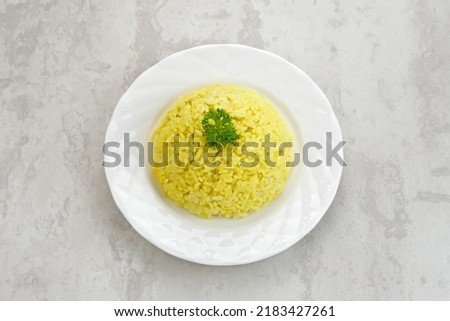 Nasi kuning, Indonesian traditional food, made from rice cooked with turmeric and coconut milk and spices.
 Royalty-Free Stock Photo #2183427261